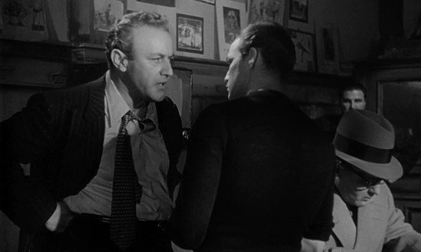 black and white Lee J Cobb confronts Marlon Brando in On the Waterfront