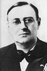 A black and white photo of René Carmille wearing glasses and a bow tie