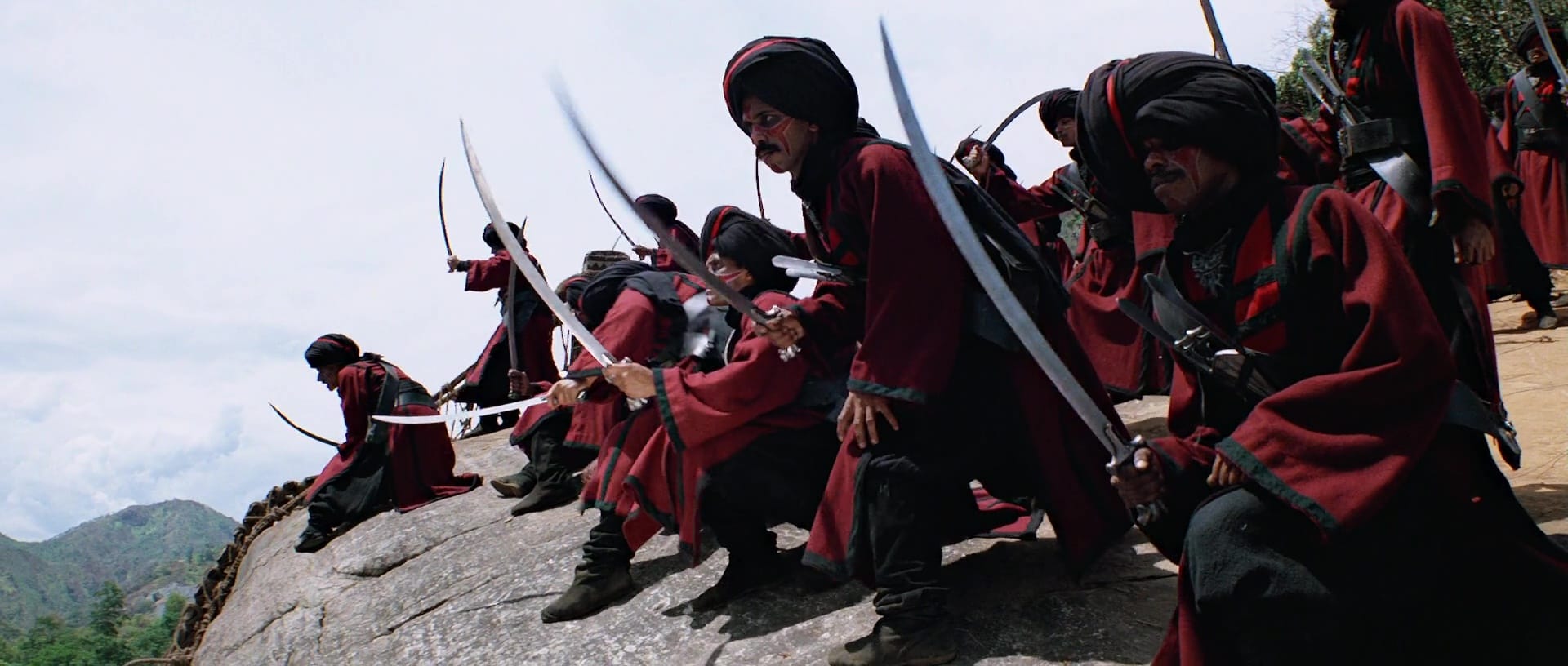 Thuggee soldiers in red and white uniforms with turbans and scimitars from Temple of Doom